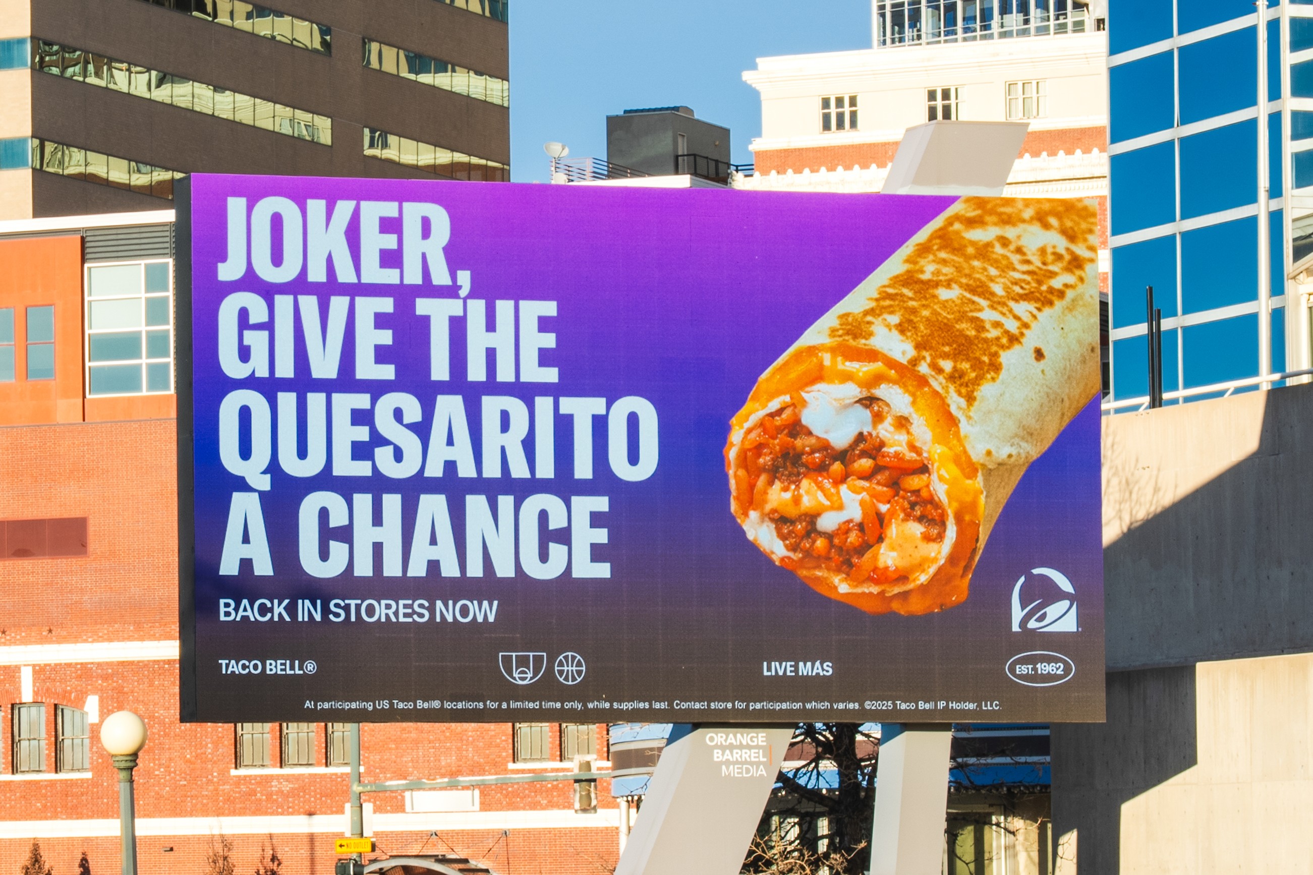 Bilboard saying "Joker Give the Quesarito a chance!" 